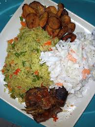 Fried Rice, salad, plantain, and Goatmeat